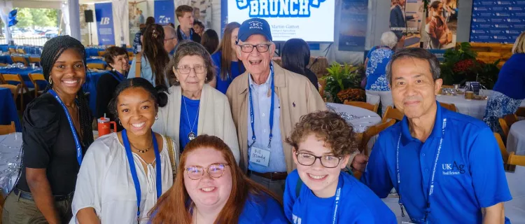 A group of students and alumni attend the 2023 Martin-Gatton CAFE Scholarship Brunch outside the Good Barn.