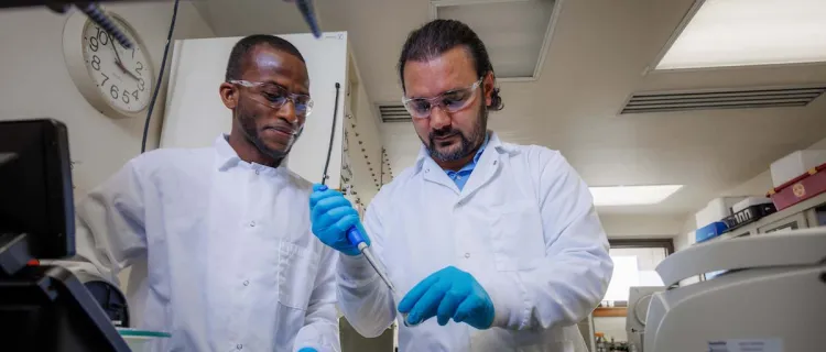 Two people work in a lab