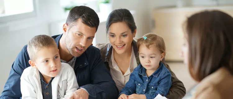 A family of four meets a financial counselor