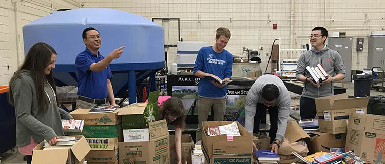 Alpha Epsilon Omega Chapter members collect books for their annual book drive