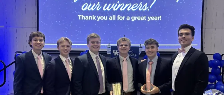 Alpha Gamma Rho members accept a fraternity award
