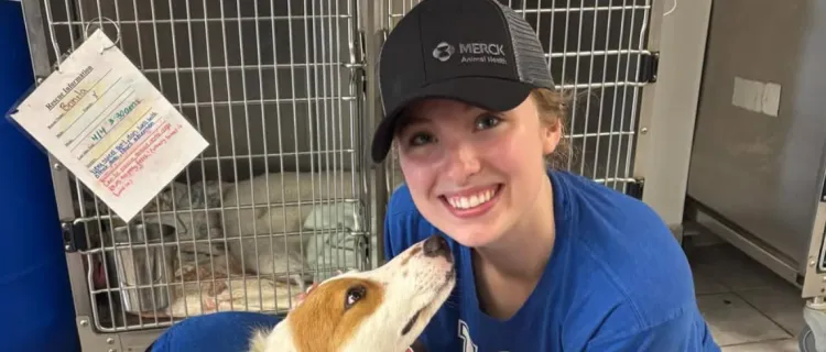 A CVF member pets a dog at a service event