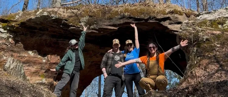 Student Chapter of the Society of American Foresters members at a rock formation