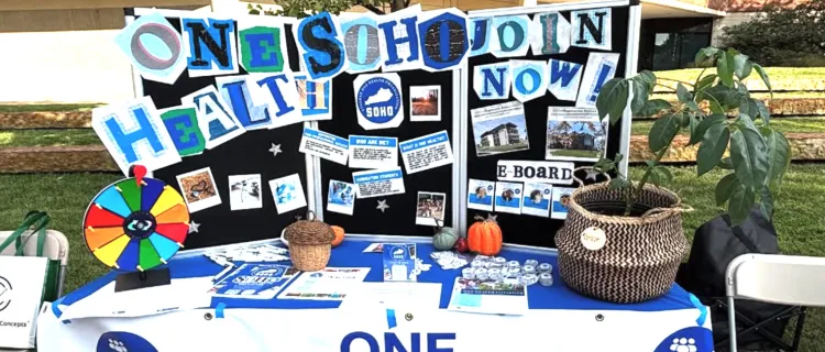 A table for the Student One Health Organization at an event