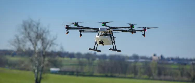 A drone flies over a farm