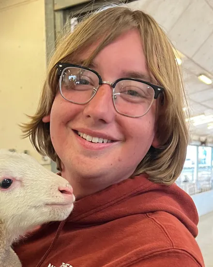 Jesse Fulkerson holds a lamb