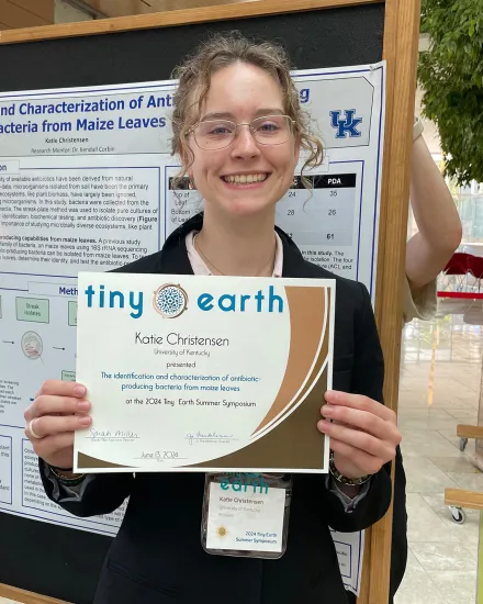Katie Christensen holds a presentation certificate