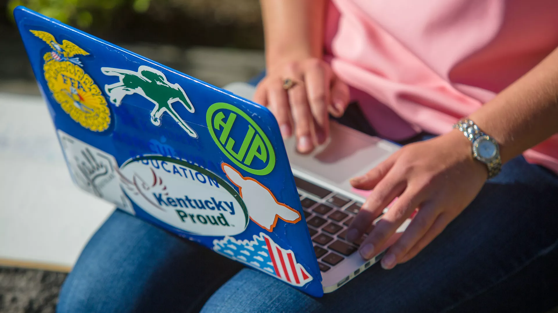 A person works on a laptop