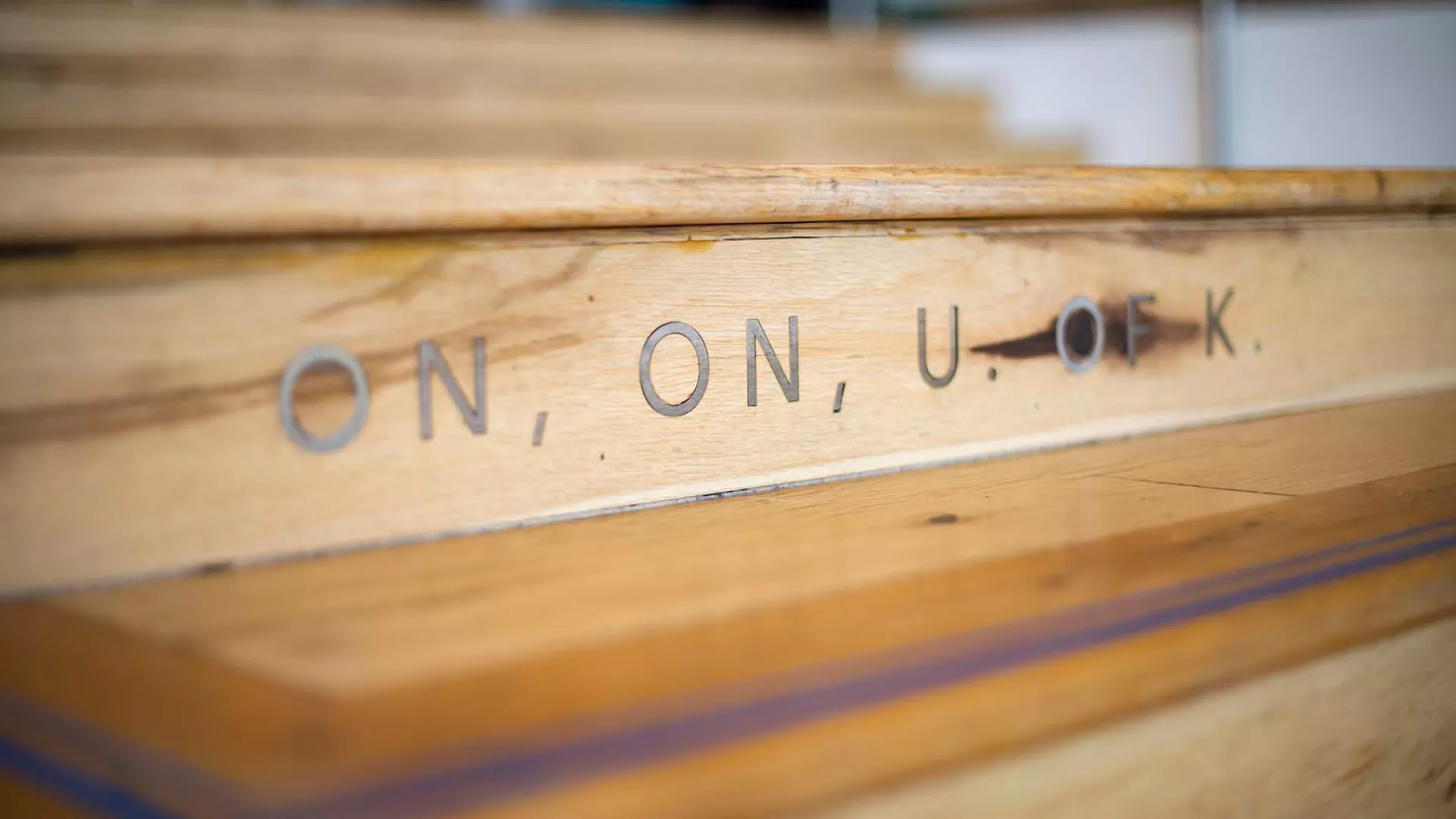 The Gatton Student Center steps with the words "on, on, U of K"