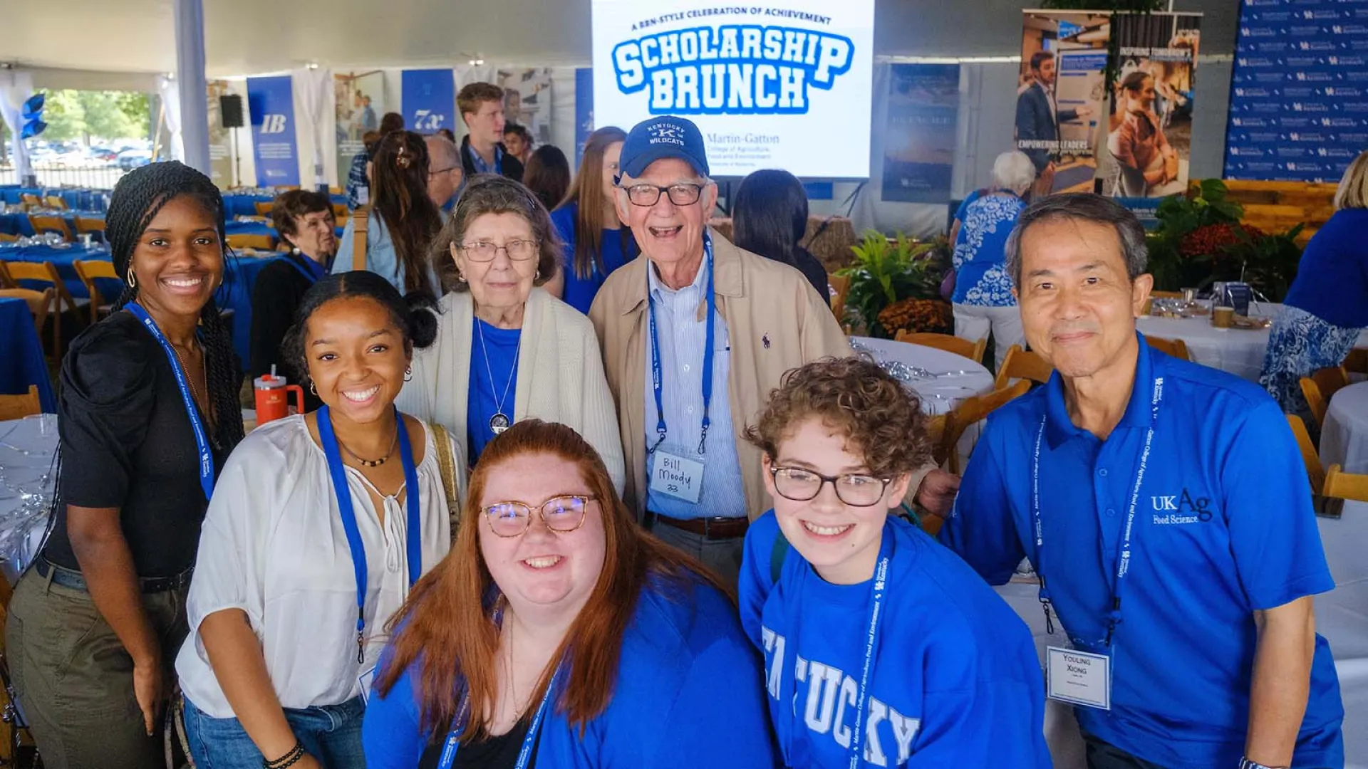 A group of students and alumni attend the 2023 Martin-Gatton CAFE Scholarship Brunch outside the Good Barn.
