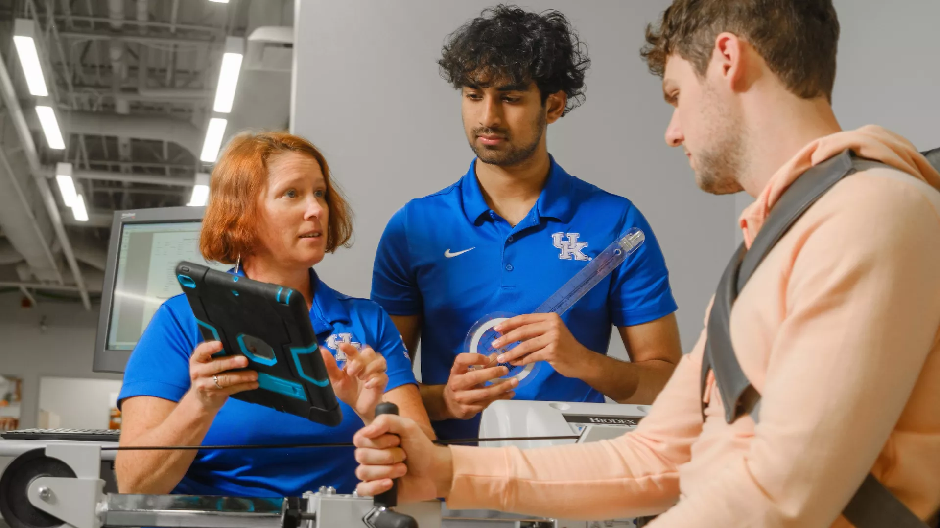 ABT student Afeef Shaik works in the Sports Medicine Research Institute with mentor Assistant Professor Kimberly Tumlin.