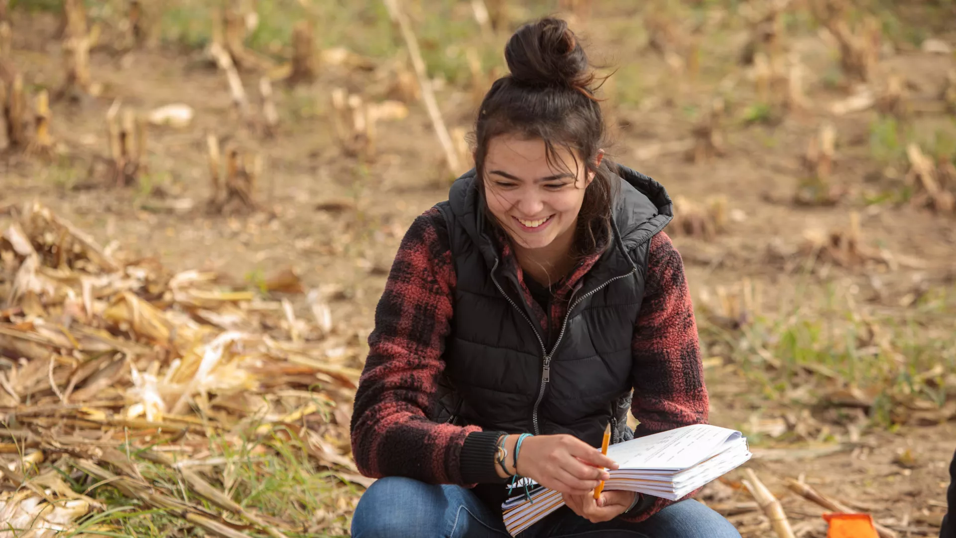 A student participates in Soil Class on Spindletop Farm.