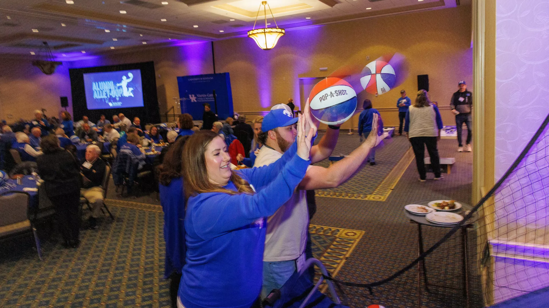 The UK Martin-Gatton CAFE celebrates Alumni Alley-Oop before the UK Men's Basketball game.