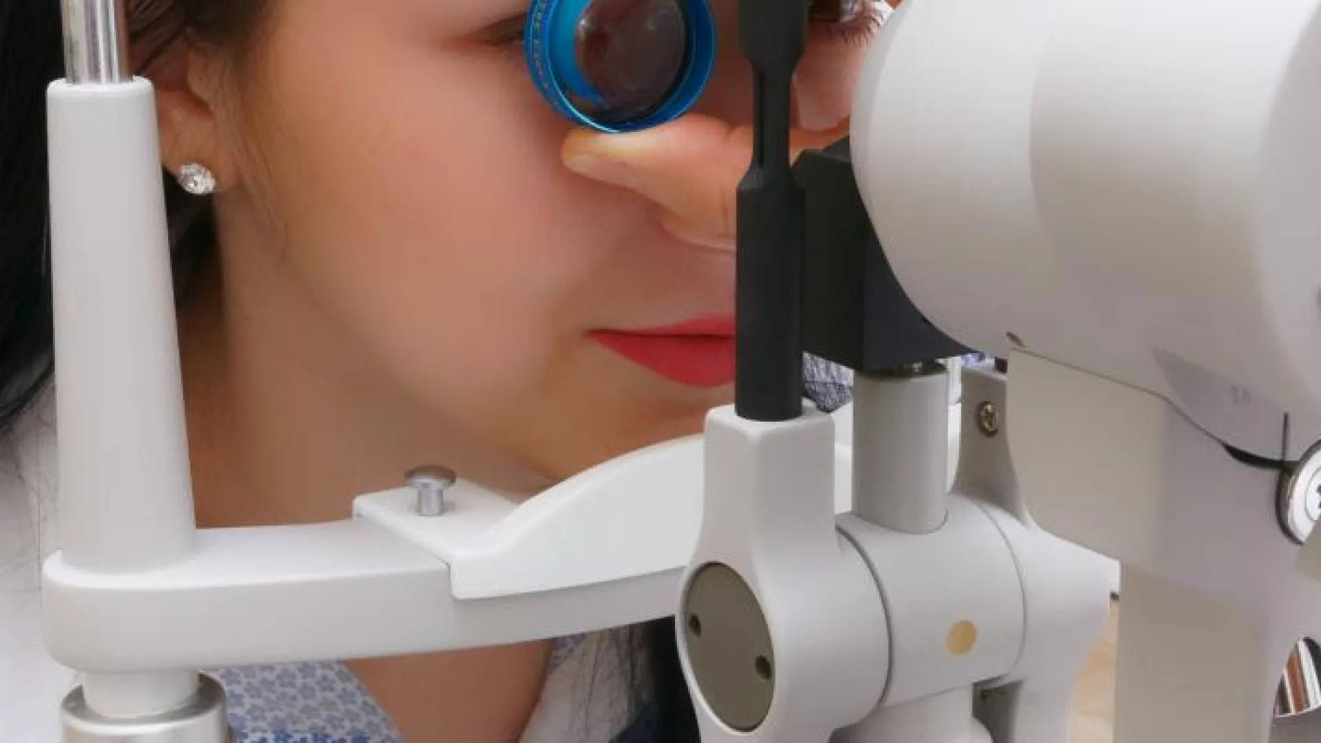 An optometrist conducts an eye exam