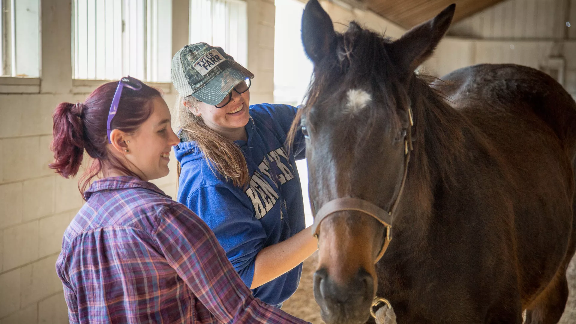 Two students with a horse