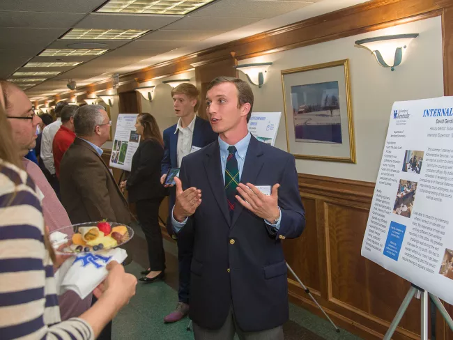 Agriculture Economics undergraduate students present posters at the AgEcon Symposium in the Good Barn.