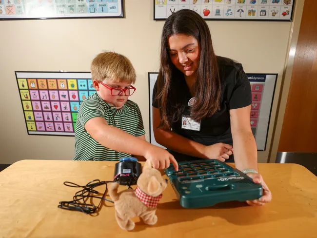 A student clinician helps a child with learning activities on July 16, 2024. Photo by Carter Skaggs | UKphoto