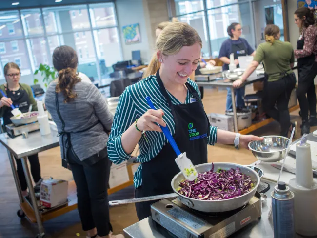 ACTIONS, Local Food System Summit, cooking Visitors for the 2020 Ky Local Food Systems Summit diced and cooked vegetables in the Culinary Medicine class at the Food Connection.
