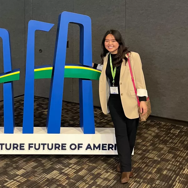 Audrey Wirasatki with an Agriculture Future of America display