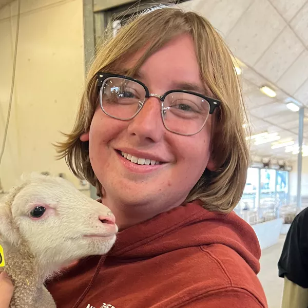 Jesse Fulkerson holds a lamb