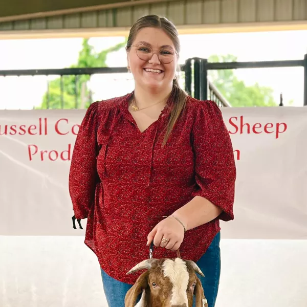 Jessie Bryant with a goat