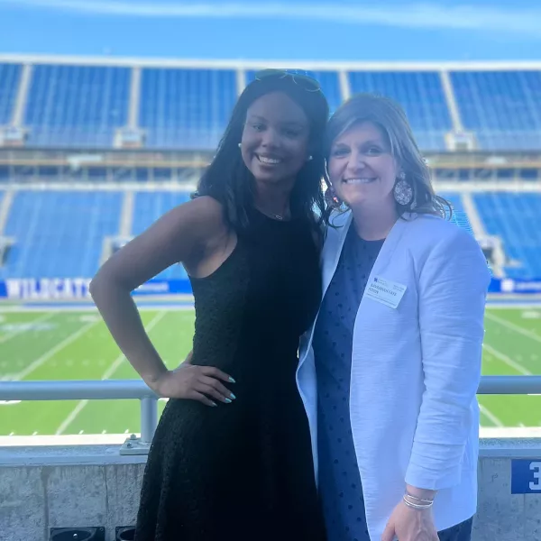 Lexi Robin with a woman at the football field