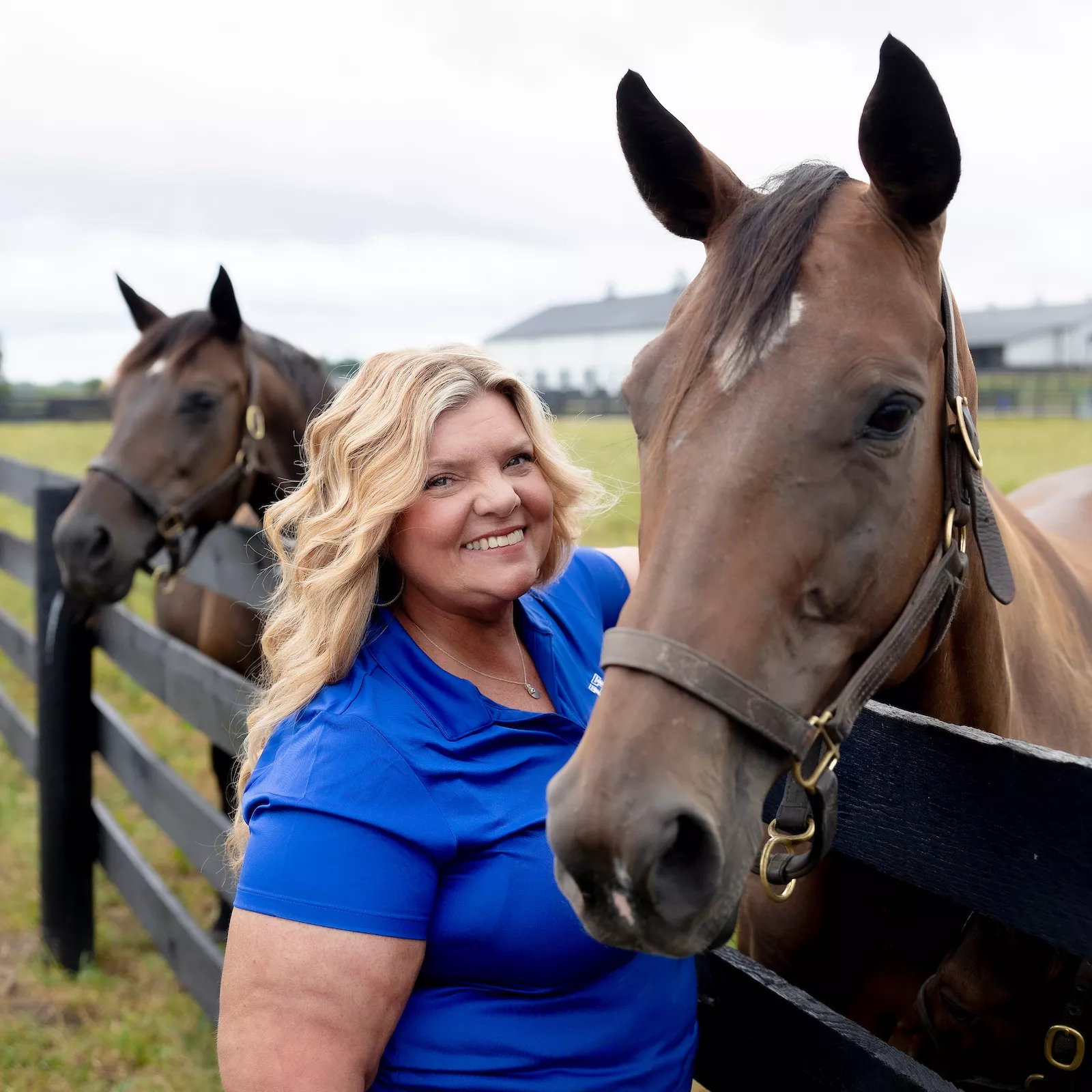 Heather MacKenzie stands with a horse
